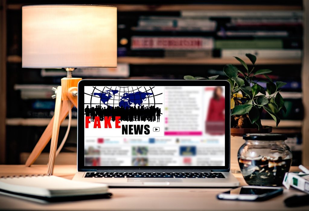 Canva-Laptop-Showing-Fake-News-1024x701